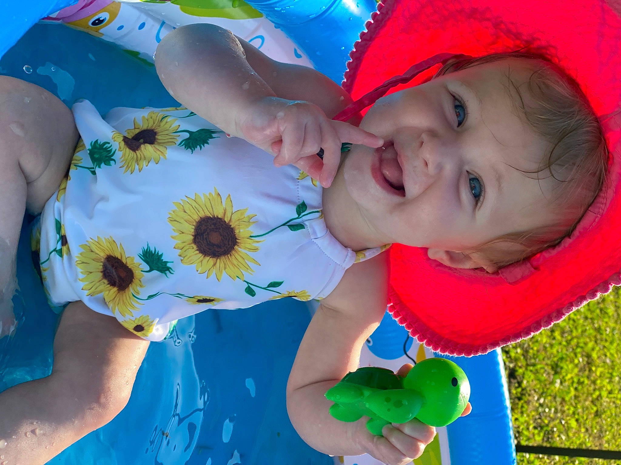 Raylee joined the competition — help win amazing prizes! baby_toddler_clothing, beauty, blue, cap, child, facial_expression, finger, fun, gesture, grass, green, happy, leisure, people_in_nature, person, petal, product, smile, summer, t_shirt