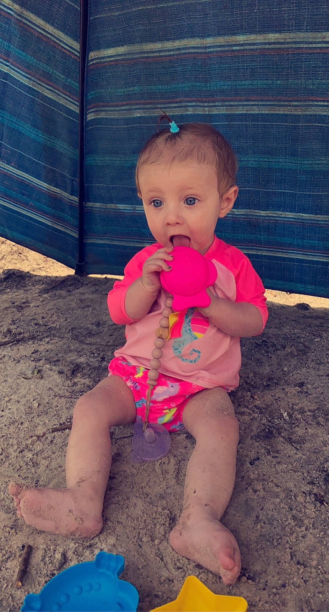 Raylee is registered to the contest to win money with this photo: baby, baby_toddler_clothing, eye, face, finger, foot, fun, grass, happy, head, human_leg, knee, leg, leisure, person, pink, shoulder, skin, surprise, thigh