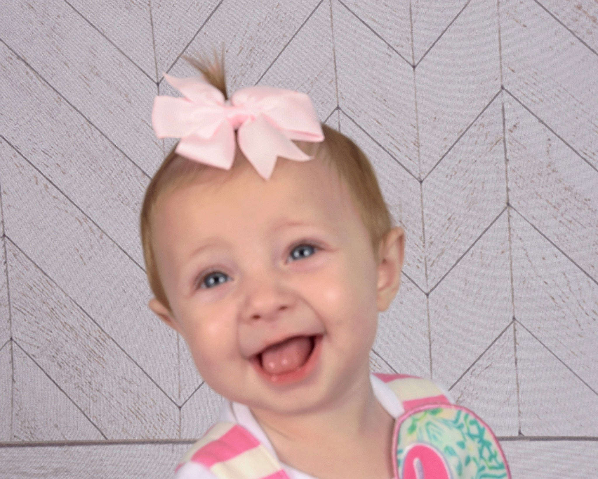 Raylee is registered to the contest to win money with this photo: baby, baby_toddler_clothing, cheek, eye, eyebrow, eyelash, face, hairstyle, happy, head, headgear, iris, joy, magenta, nose, person, petal, pink, skin, smile