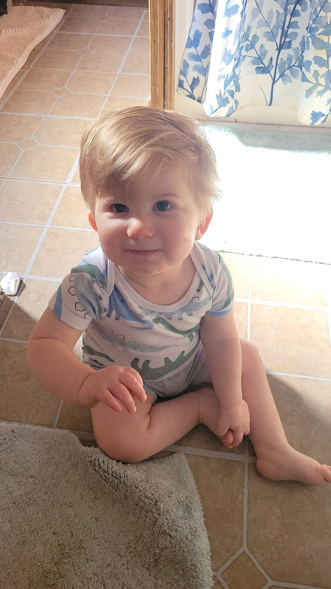 Levi joined the competition — help win amazing prizes! arm, baby, baby_toddler_clothing, cheek, chin, curtain, facial_expression, finger, floor, flooring, joint, joy, mouth, nose, person, picture_frame, skin, sleeve, smile, standing