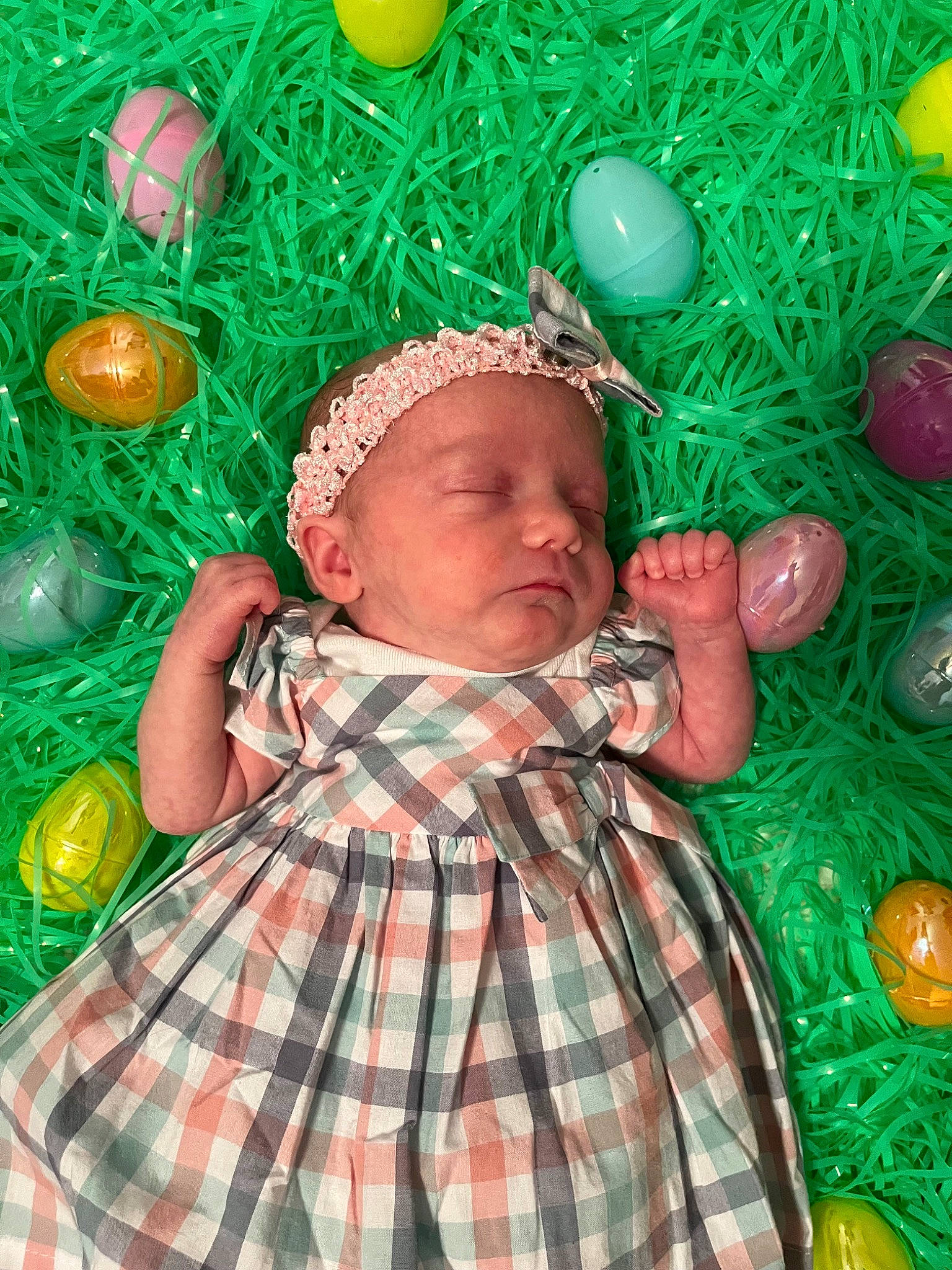 Sadie is registered to the contest to win money with this photo: adaptation, baby, baby_toddler_clothing, child, christmas_ornament, event, fun, grass, green, happy, holiday, leisure, pattern, people_in_nature, person, plaid, play, tartan, toddler, tradition