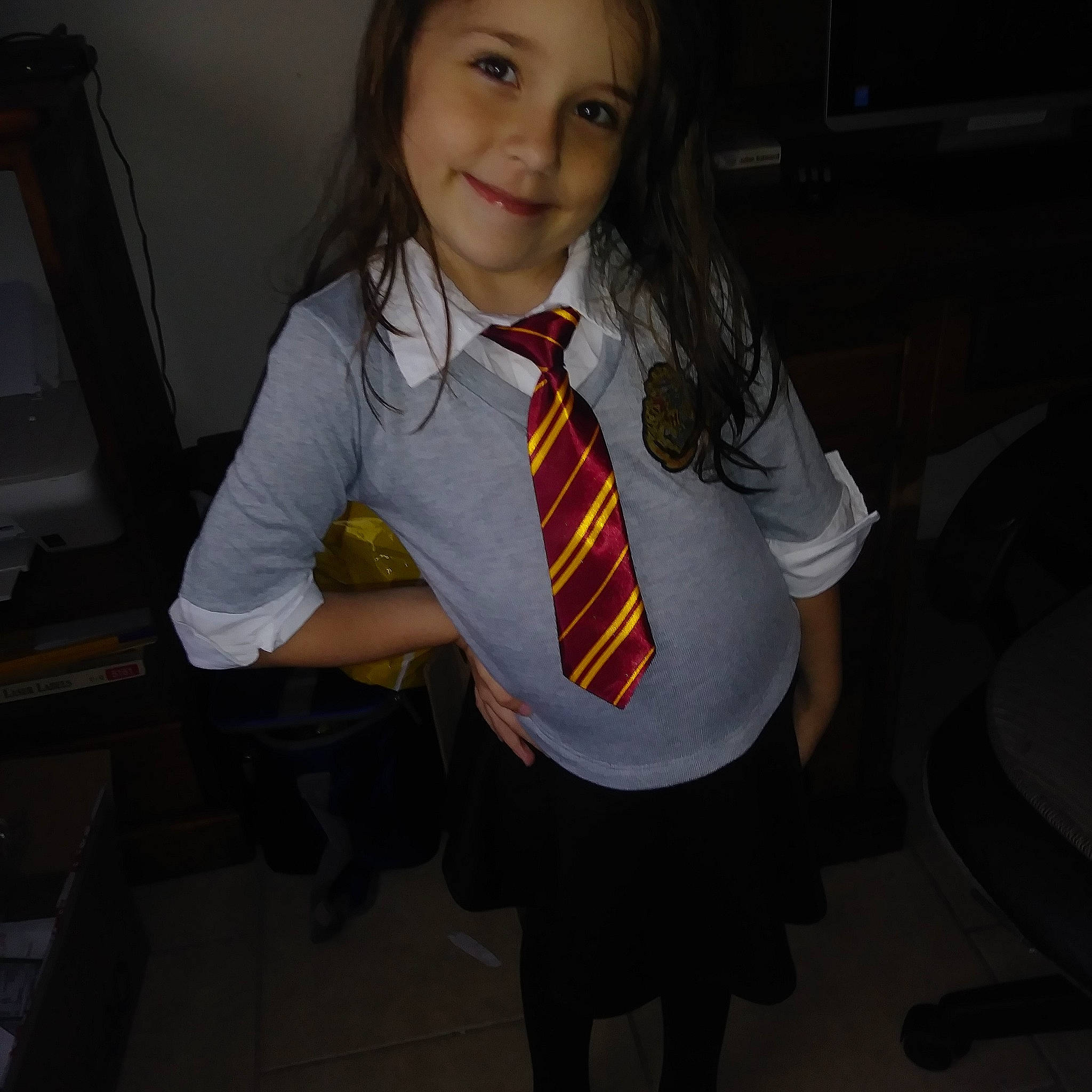 Cozette is registered to the contest to win money with this photo: child, fashion_accessory, fun, joy, long_hair, outerwear, person, school_uniform, smile, uniform
