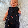 baby, smiling, infant, blue_blanket, navy_outfit, rocket_pattern, watermelon_pattern, lying_down, happy, cute, child, one_person, indoors, textured_blanket, clothing, portrait, small_child, human, baby_clothes, joyful