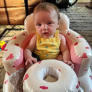 Brylynn joined the competition — help win amazing prizes! baby, infant, child, yellow_onesie, inflatable_seat, pink, white, candy_print, bunny_print, face, expression, home_interior, carpet, chair, toy, floor, person, sitting, cute, indoor