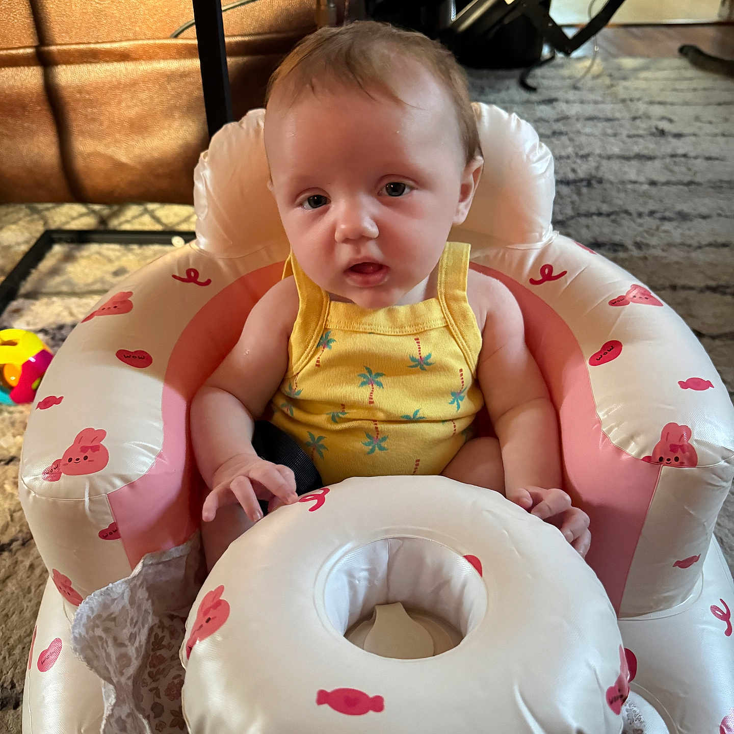 Brylynn joined the competition — help win amazing prizes! baby, infant, child, yellow_onesie, inflatable_seat, pink, white, candy_print, bunny_print, face, expression, home_interior, carpet, chair, toy, floor, person, sitting, cute, indoor