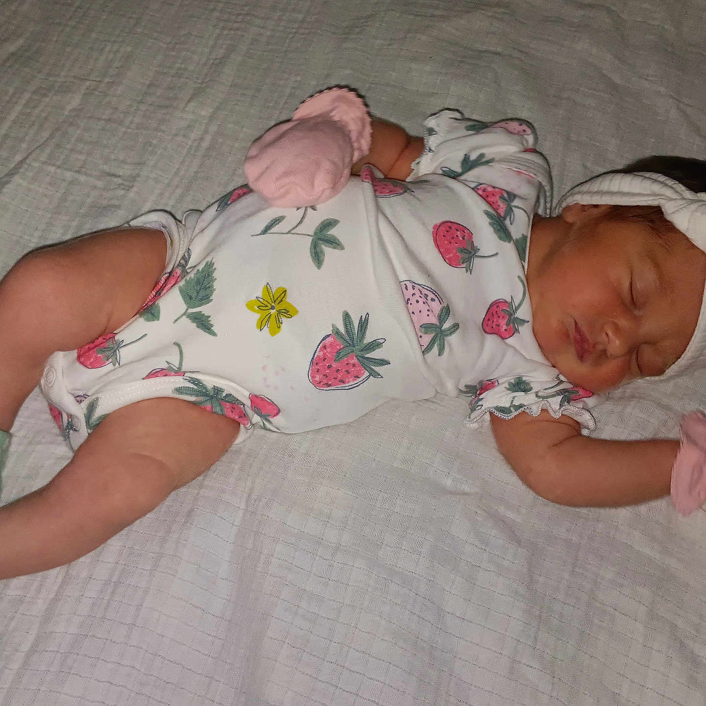 Jazmine Serenity is registered to the contest to win money with this photo: baby, blanket, child, cute, green, headband, indoors, infant, lying_down, mittens, newborn, onesie, peaceful, pink, portrait, sleeping, socks, soft_texture, strawberry_pattern, white