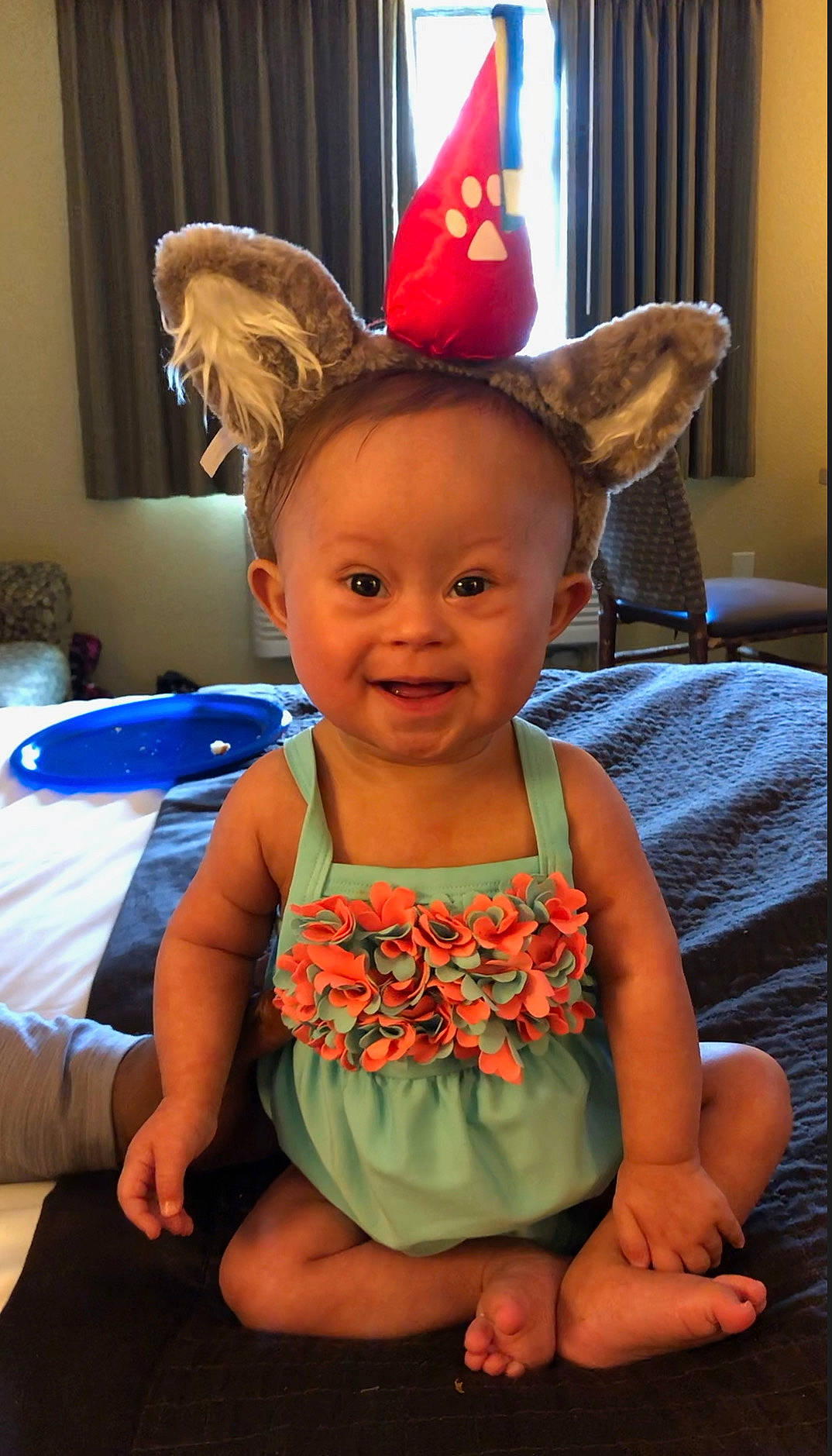 Aaleyah is registered to the contest to win money with this photo: child, ear, fashion_accessory, hat, head, headgear, joy, person, sitting, smile, toddler