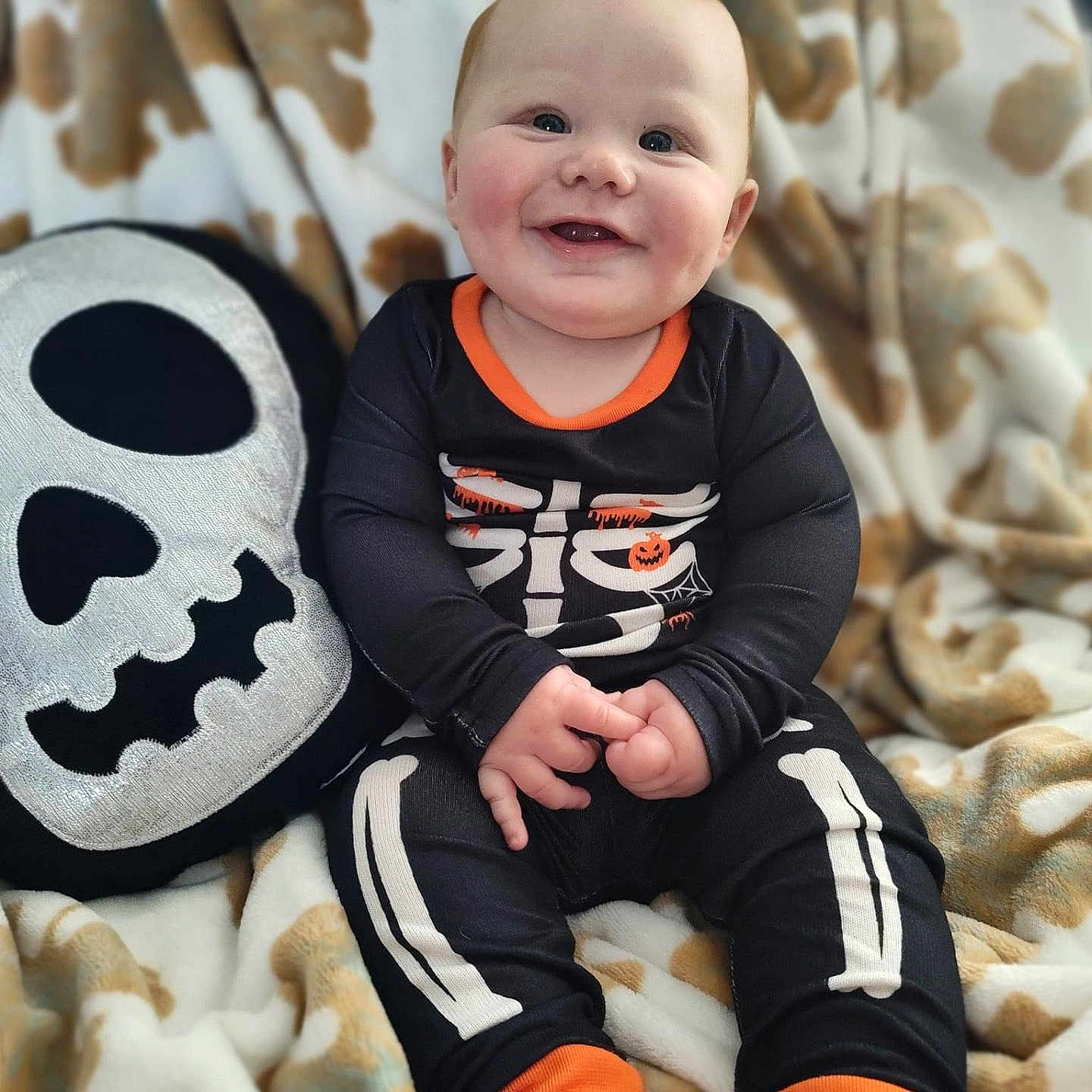 Ashton is registered to the contest to win money with this photo: animal, baby, ball, clothing, cushion, face, football, happy, head, homedecor, pants, person, photography, portrait, sitting, smile, soccer, soccerball, sport, t_shirt