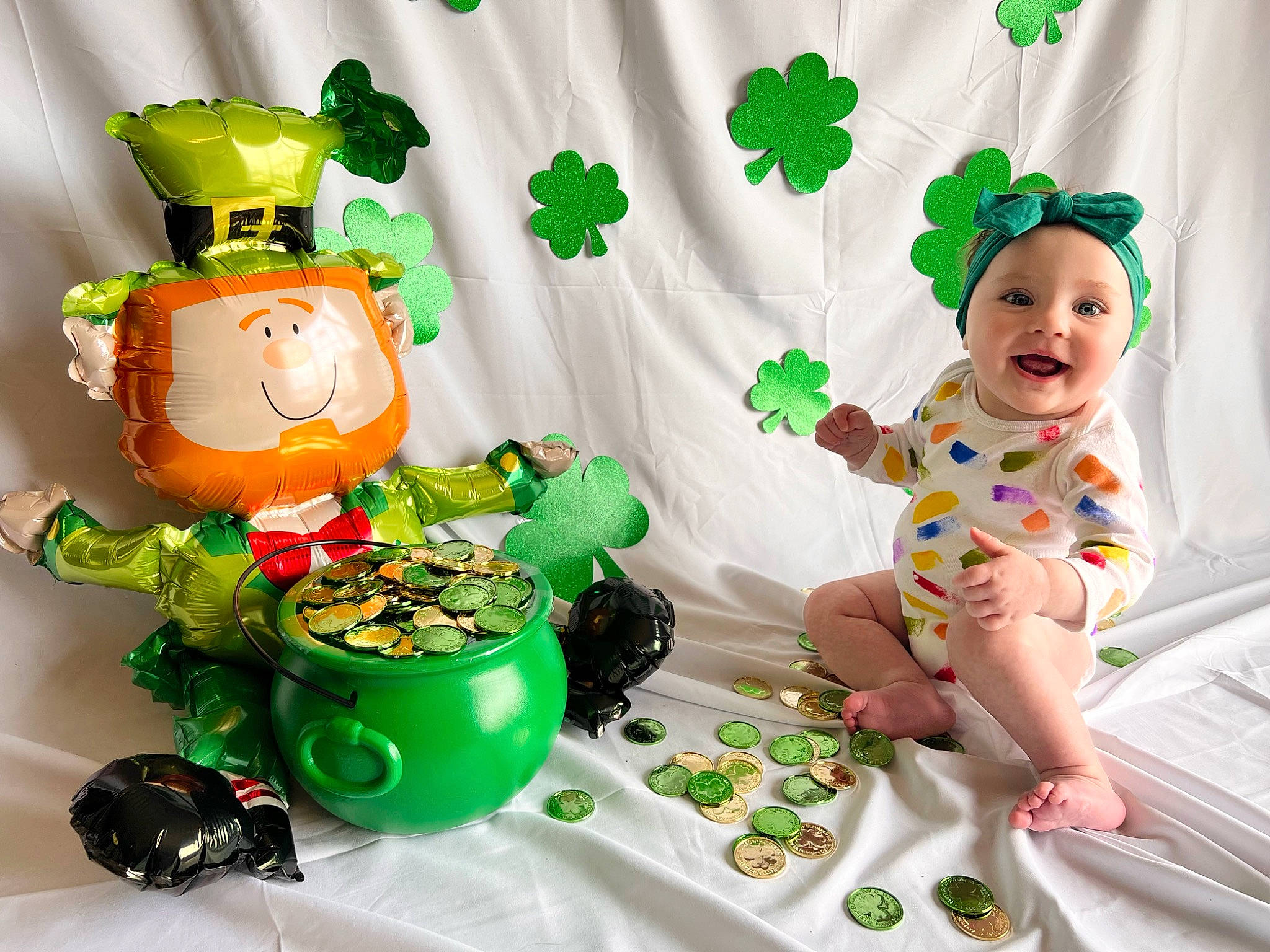 Denver is registered to the contest to win money with this photo: action_figure, animation, art, baby, baby_products, baby_toddler_clothing, baby_toys, event, fictional_character, green, happy, headwear, holiday, houseplant, joy, lawn_ornament, person, plastic, play, smile