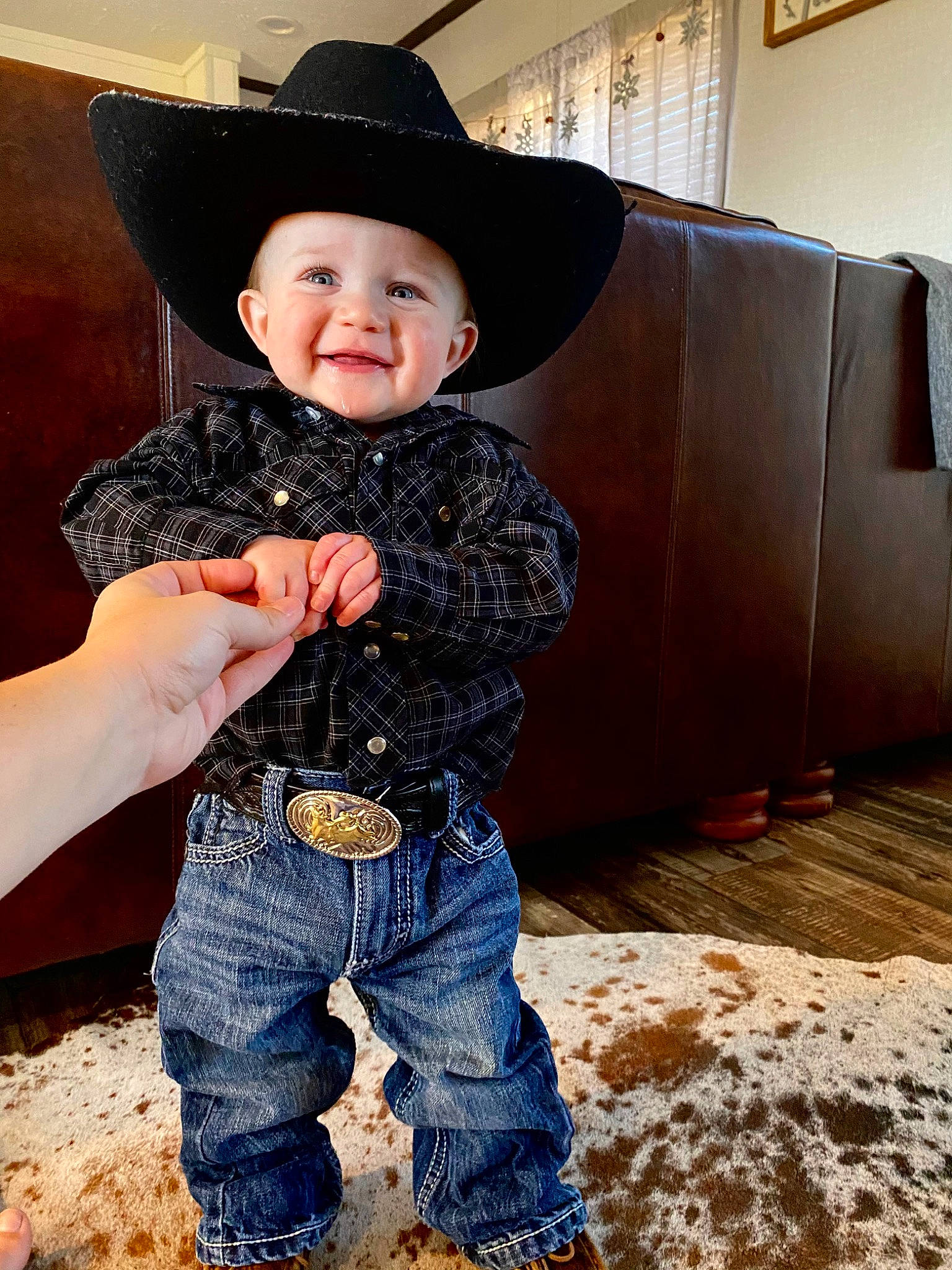 Kohen is registered to the contest to win money with this photo: baby_toddler_clothing, chin, cowboy_hat, denim, eye, face, flash_photography, fun, happy, hat, head, headgear, headwear, joy, mammal, person, skin, sleeve, smile, standing