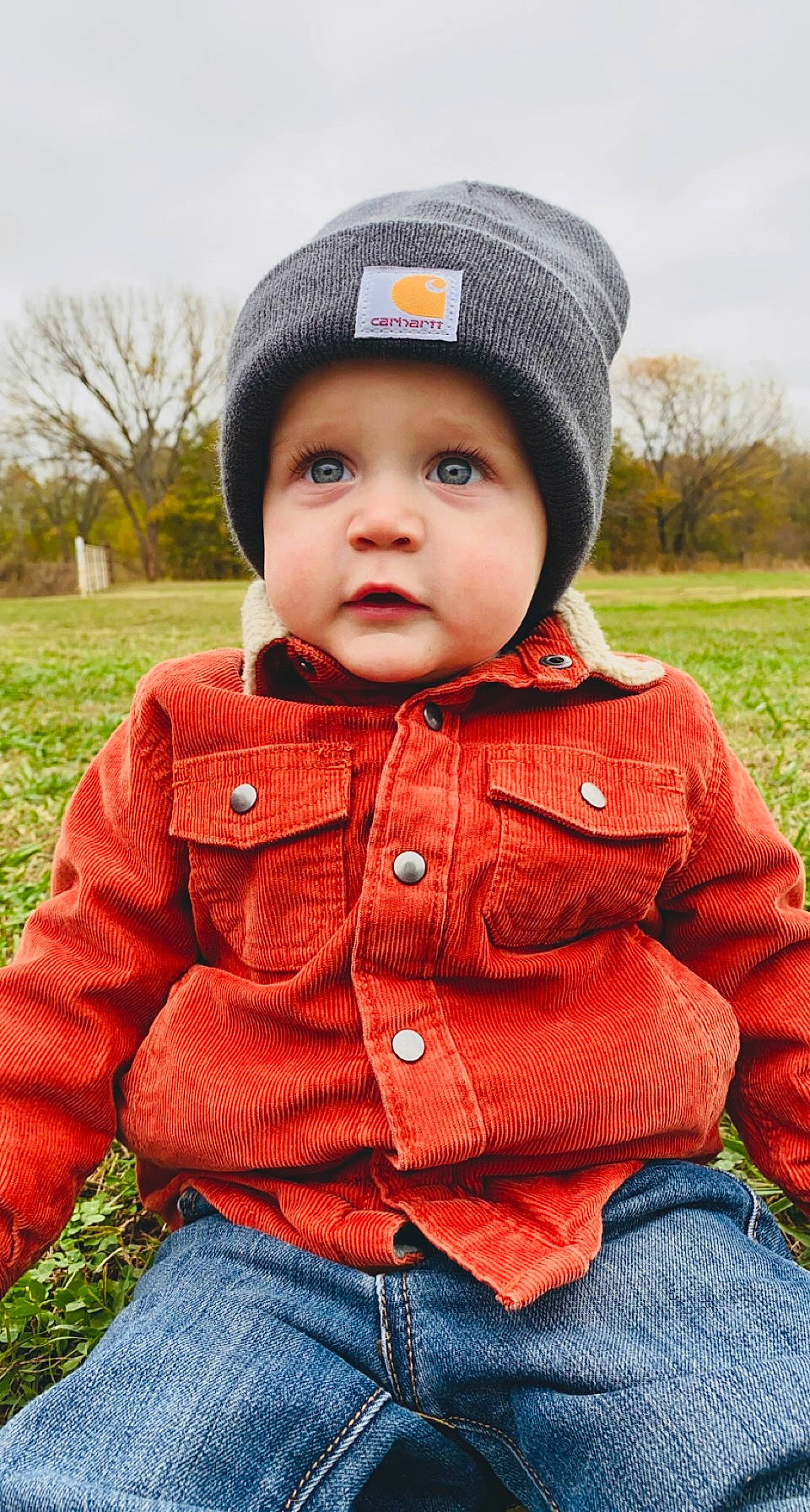 Kohen joined the competition — help win amazing prizes! baby_toddler_clothing, cap, clothing, collar, cool, eye, grass, happy, headgear, headwear, jeans, lip, outerwear, people_in_nature, person, plant, skin, sky, sleeve, tartan