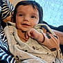 Flavio a rejoint le concours — aidez-le/la à gagner de superbes lots ! baby, infant, smiling, face, person, clothing, mickey_mouse, pattern, hand, curly_hair, indoor, couch, blanket, striped_clothing, window, curtain, happy, closeup, portrait, cozy