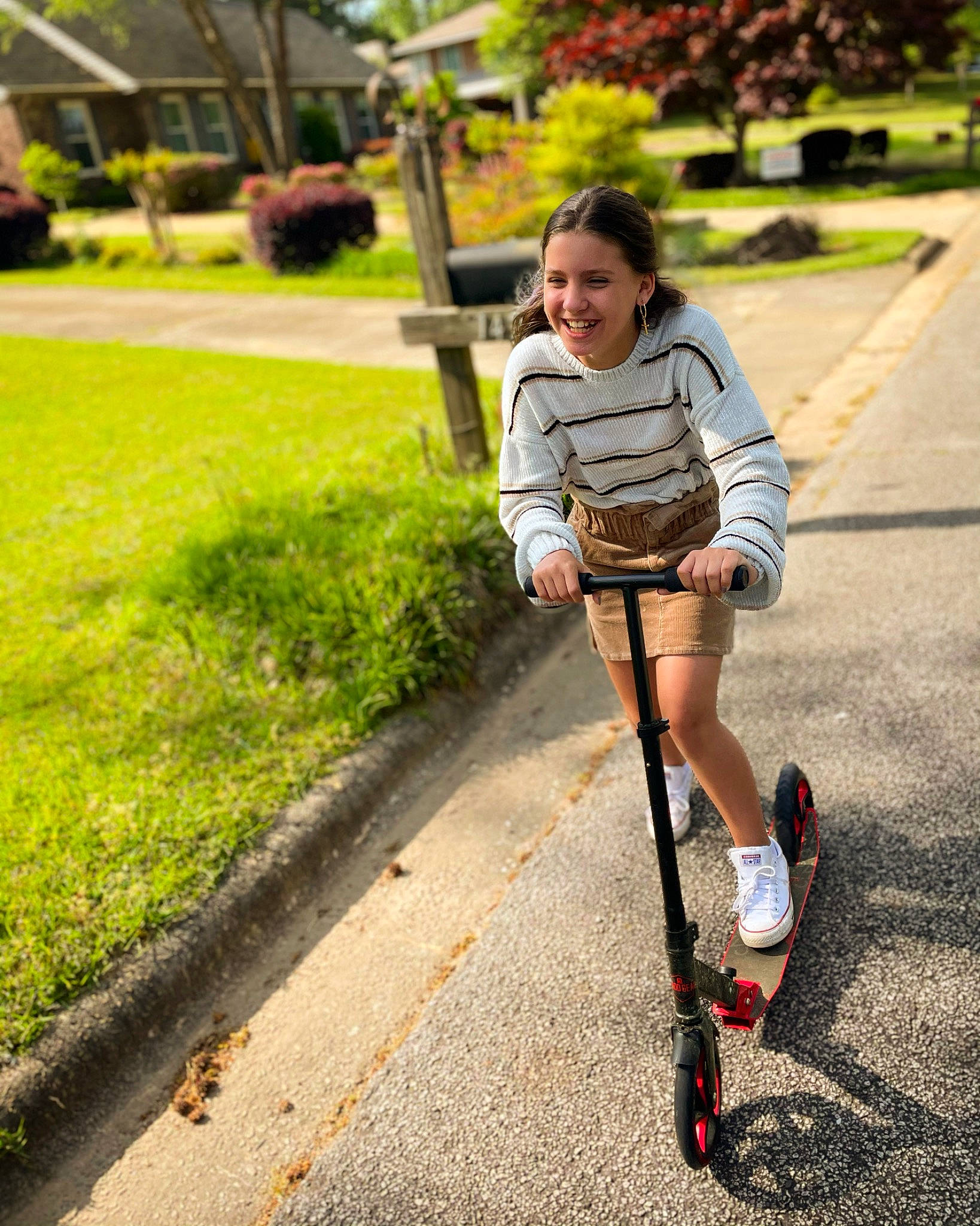 Makiyah is registered to the contest to win money with this photo: asphalt, baby_carriage, bicycle_accessory, grass, green, joy, kick_scooter, leisure, people_in_nature, person, plant, road_surface, rolling, shorts, sidewalk, smile, sneakers, street_fashion, tire, toddler