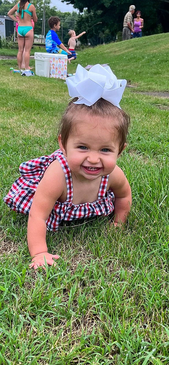 Amyah joined the competition — help win amazing prizes! baby, baby_toddler_clothing, blurred, child, fun, grass, grass_family, grassland, hairstyle, happy, lawn, leaf, meadow, pattern, people_in_nature, person, plant, sitting, smile, summer