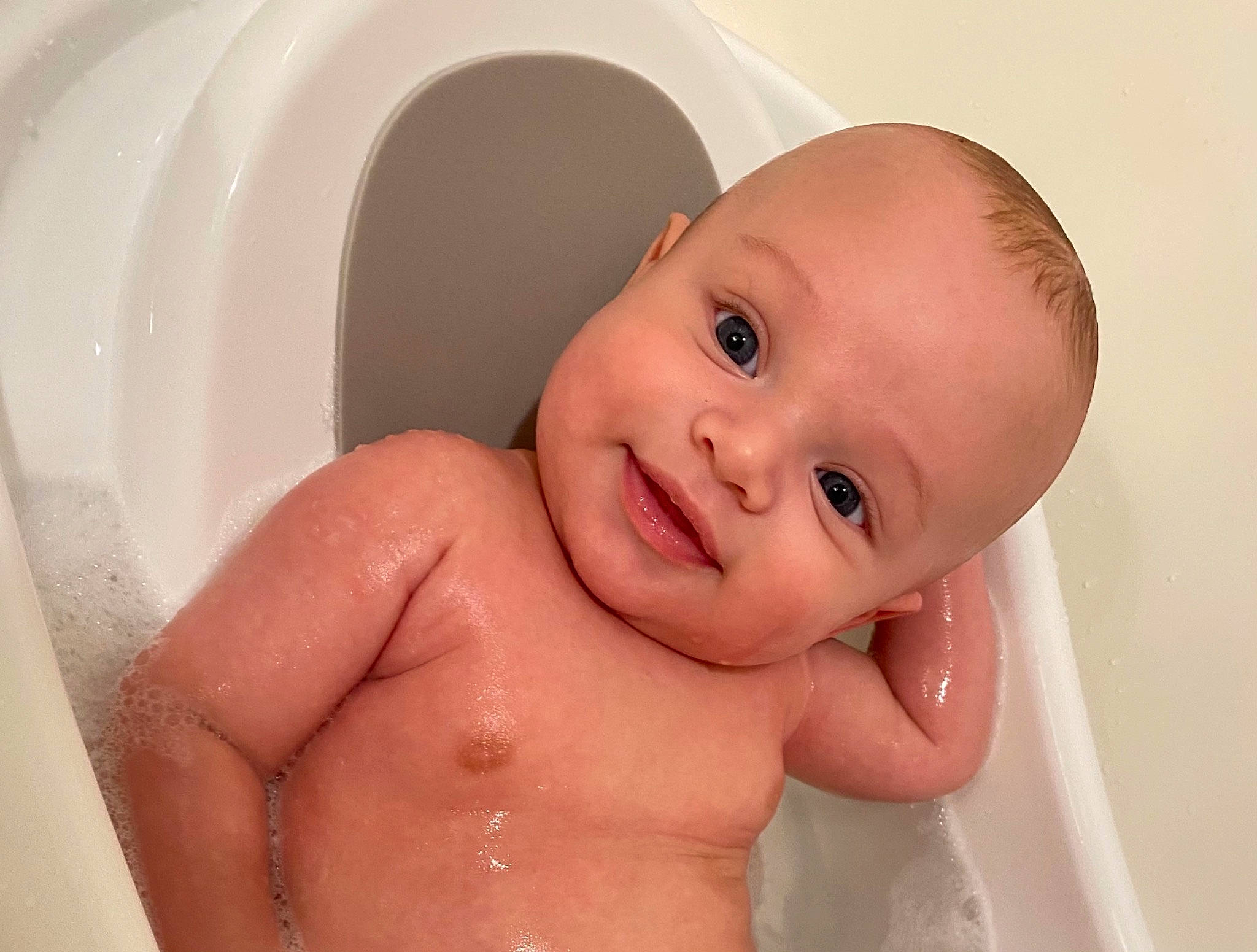 Chandler is registered to the contest to win money with this photo: baby, baby_bathing, bathing, bathroom, bathtub, cheek, ear, eye, eyebrow, eyelash, finger, fluid, iris, jaw, joy, lip, mouth, nose, person, product