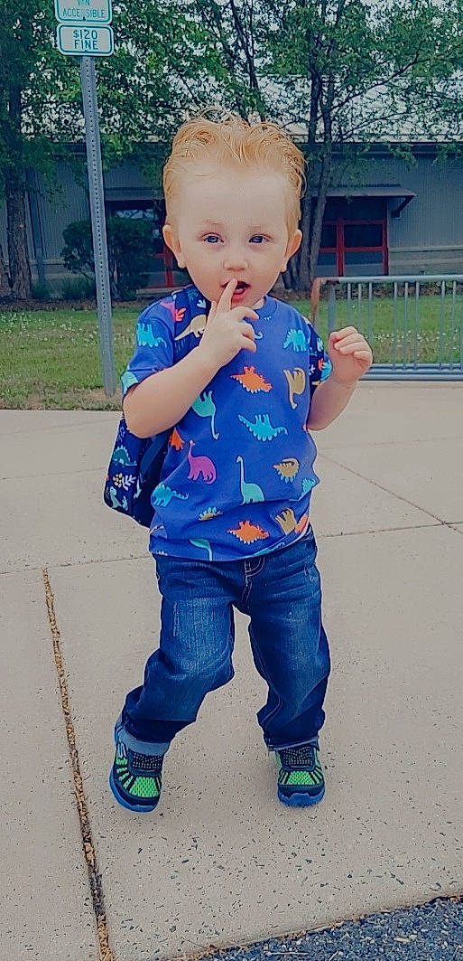 Jaxon is registered to the contest to win money with this photo: baby, baby_toddler_clothing, cool, face, facial_expression, gesture, grass, hair, hairstyle, hand, happy, head, jeans, joint, nose, people_in_nature, person, plant, sleeve, standing