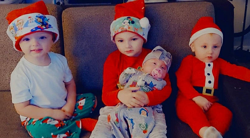 Bryson is registered to the contest to win money with this photo: baby_toddler_clothing, cap, child, event, eye, face, facial_expression, fun, happy, head, headgear, headwear, human, human_body, lap, organ, people, person, skin, smile