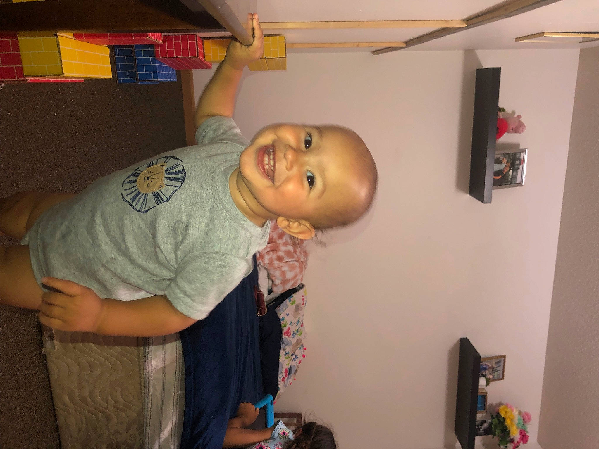 Luca is registered to the contest to win money with this photo: abdomen, baby, chest, child, fun, happy, house, joy, mouth, person, room, shelf, smile, t_shirt, toddler