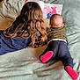 Maialen participe au concours pour gagner de l'argent avec cette photo : baby, back_view, bedroom, blanket, book, casual_clothing, child, children, cozy, green_shirt, indoor, jeans, laying_down, long_hair, picture_book, reading, red_socks, siblings, storytime, toddler