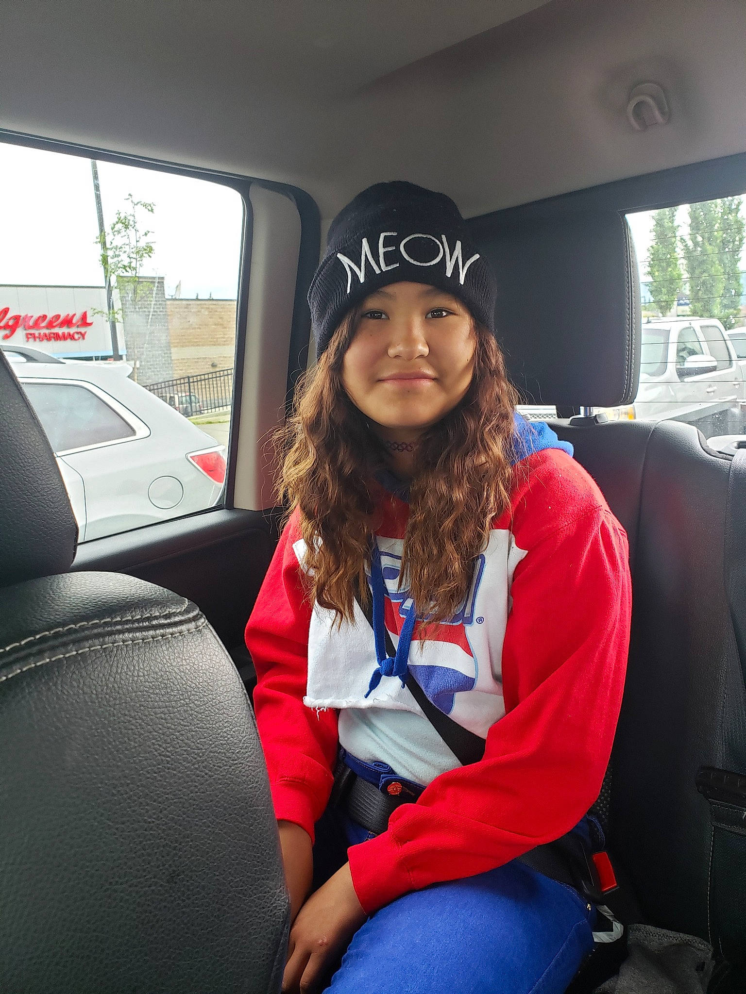 Jacqueline is registered to the contest to win money with this photo: auto_part, beanie, car, car_seat, driving, headwear, joy, passenger, person, subcompact_car, transport, vacation, vehicle