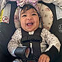 Anyssa is registered to the contest to win money with this photo: accessories, baby, babylaughing, bonnet, clothing, cushion, face, happy, hat, head, homedecor, laughing, person, photography, portrait, smile, strap