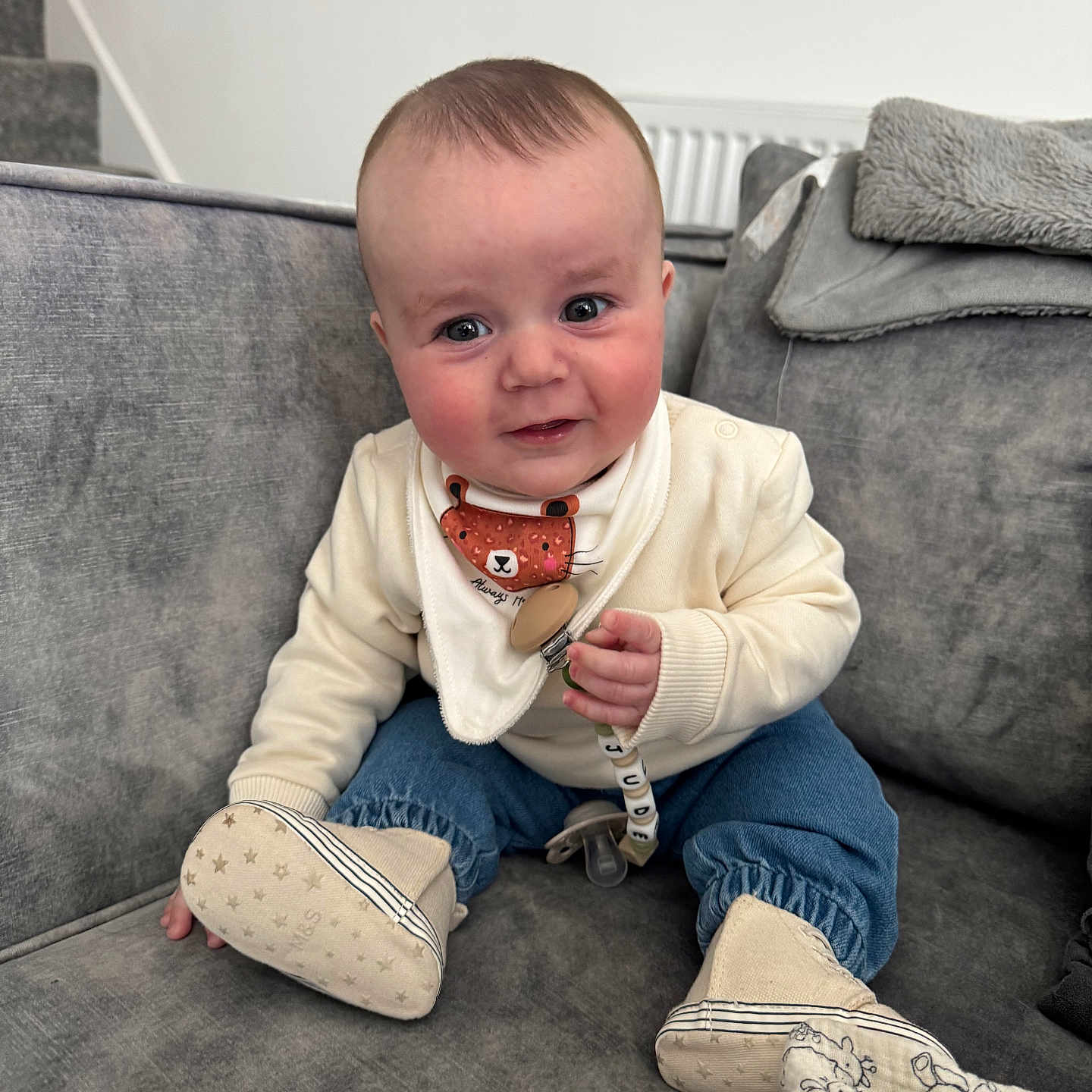 Jude joined the competition — help win amazing prizes! baby, blanket, child, clothing, comfort, couch, cute, denim, face, footwear, happy, home, indoor, infant, pacifier, person, sitting, smile, toy, young_child