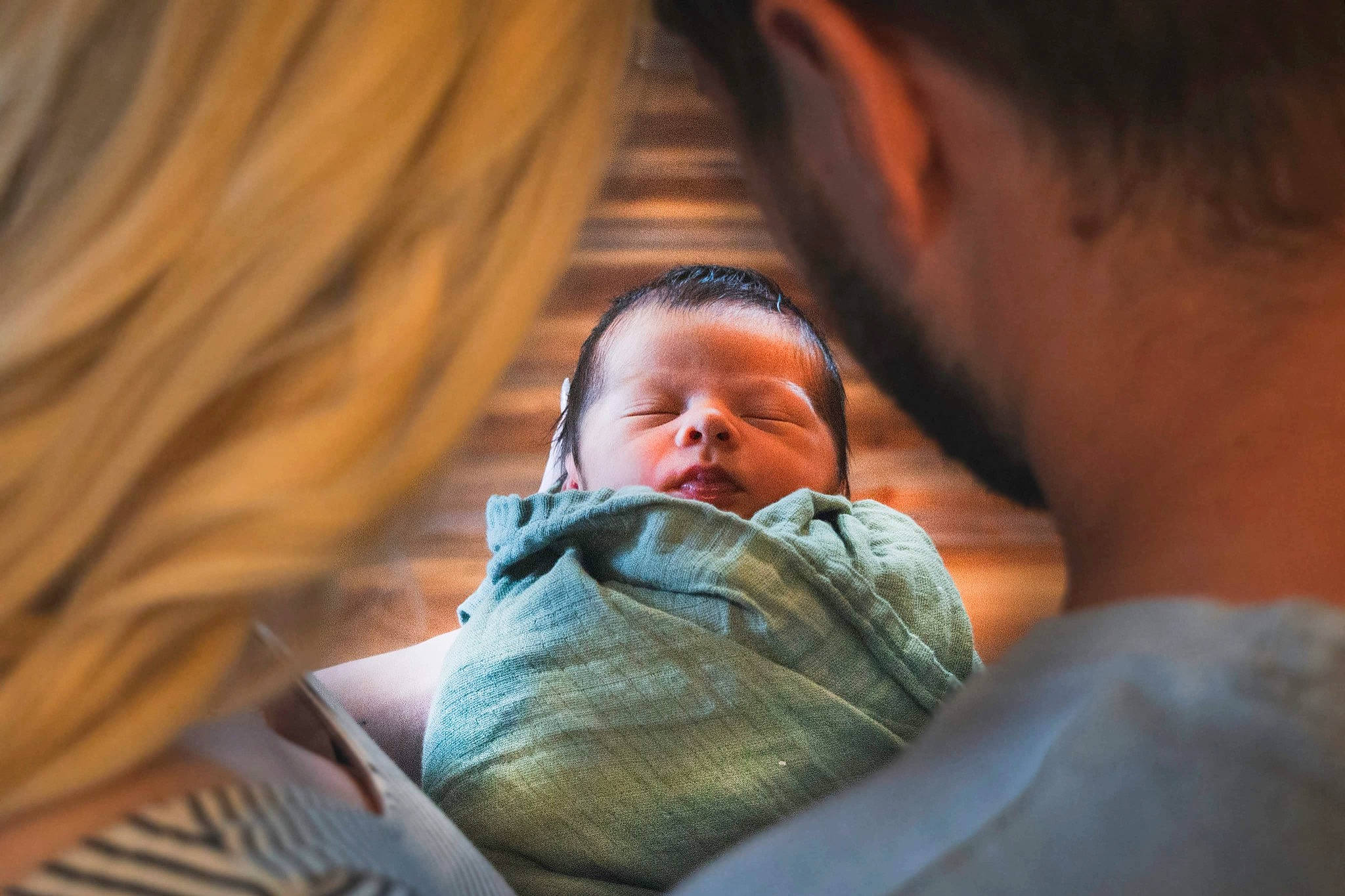 Bodee is registered to the contest to win money with this photo: baby, cheek, child, comfort, darkness, fun, gesture, happy, nose, person, room, sitting, toddler, wood