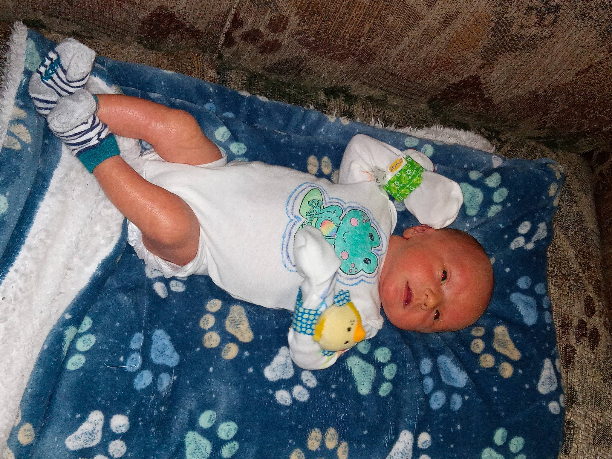 Brayson joined the competition — help win amazing prizes! baby, baby_products, baby_toddler_clothing, child, comfort, finger, foot, hand, head, human_body, human_leg, infant_bodysuit, leg, linens, pattern, person, room, sitting, sock, thigh