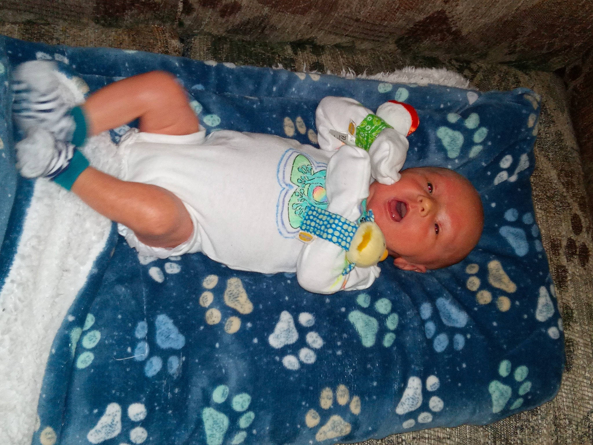 Brayson is registered to the contest to win money with this photo: baby, baby_products, baby_toddler_clothing, child, comfort, face, hat, head, linens, pattern, person, room, sock, toddler