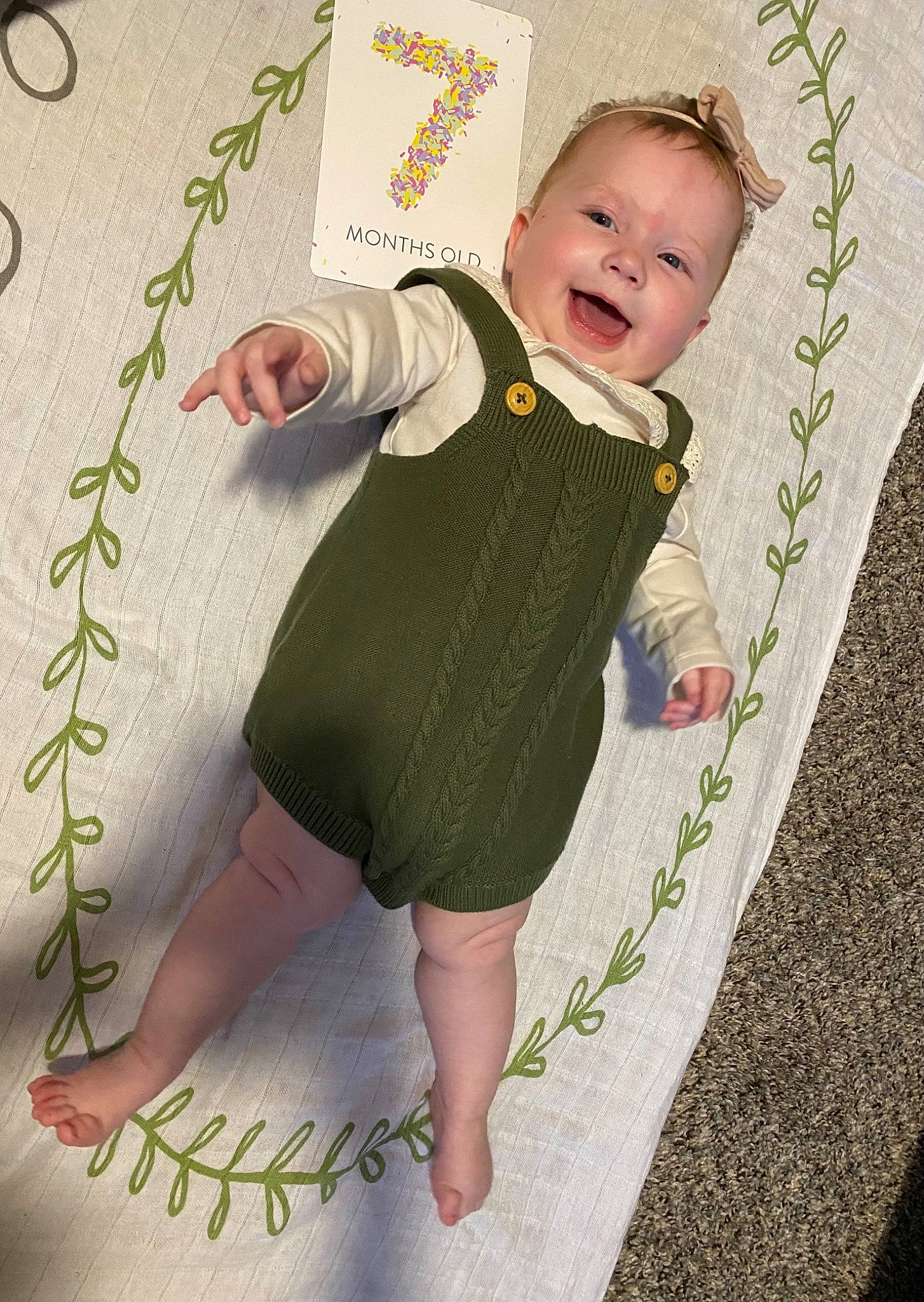 Kamila is registered to the contest to win money with this photo: baby, baby_products, baby_toddler_clothing, barefoot, child, circle, facial_expression, grass, happy, linens, pattern, people_in_nature, person, play, product, skin, sleeve, smile, t_shirt, toddler