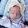 Aaliyah is registered to the contest to win money with this photo: baby, sleeping, blanket, bow, pacifier, seat, striped, soft, cozy, infant, child, headwear, clothing, comfort, closeup, resting, indoors, cute, peaceful, wrapped