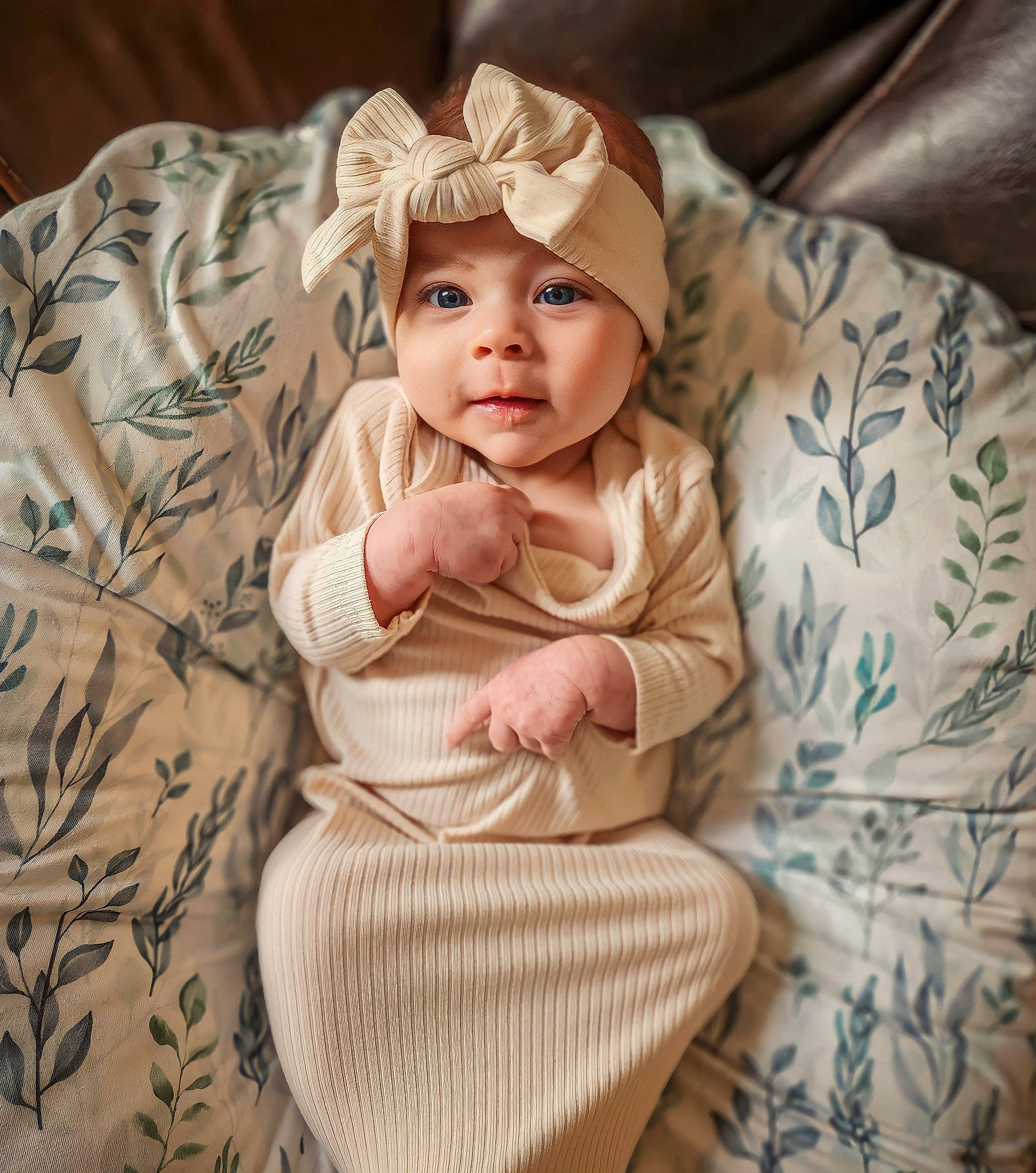 Olivia Rose is registered to the contest to win money with this photo: baby, baby_products, baby_toddler_clothing, bedding, cap, cheek, child, comfort, dress, headgear, headwear, linens, pattern, peach, person, sitting, skin, sleeve, smile, t_shirt