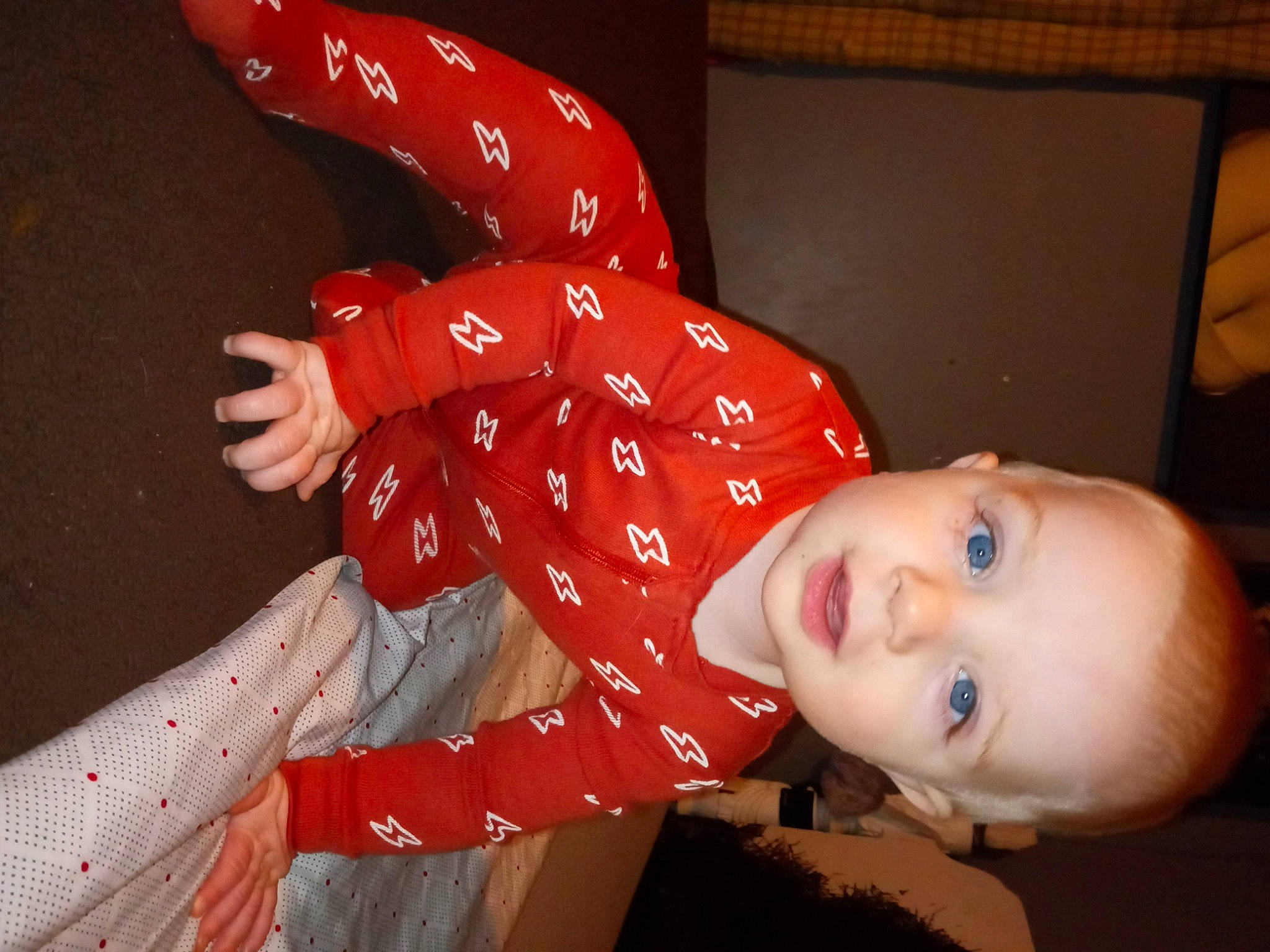 Parker is registered to the contest to win money with this photo: baby, baby_toddler_clothing, carmine, child, entertainment, flash_photography, fun, gesture, happy, human_body, human_leg, magenta, nightwear, pattern, person, portrait_photography, room, sitting, sleeve, smile