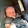 Fletcher joined the competition — help win amazing prizes! baby, infant, child, car_seat, portrait, face, eyes, looking_at_camera, awake, indoors, vehicle, safety_harness, seat_belt, straps, pink_clothing, white_clothing, orange_pattern, head, close_up, safe