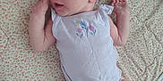 Charley is registered to the contest to win money with this photo: baby, bow, child, cute, floral, hands, headband, infant, newborn, onesie, peaceful, pink, portrait, purple, quilt, rest, skin, sleeping, small, soft