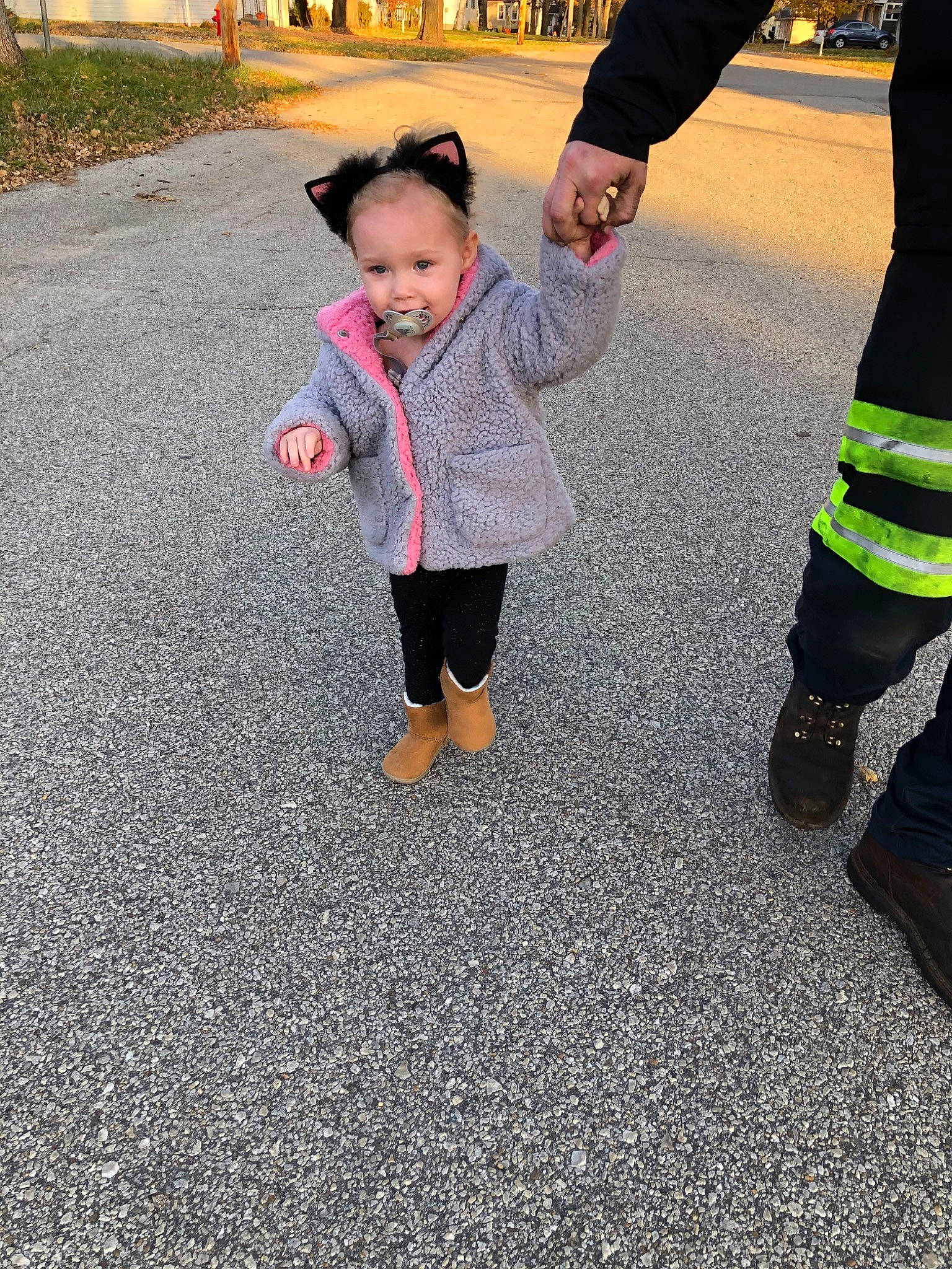 Skylin is registered to the contest to win money with this photo: asphalt, child, fun, joy, leaf, pedestrian, person, plant, play, road, road_surface, shoe, smile, standing, toddler, vacation, walking, yellow