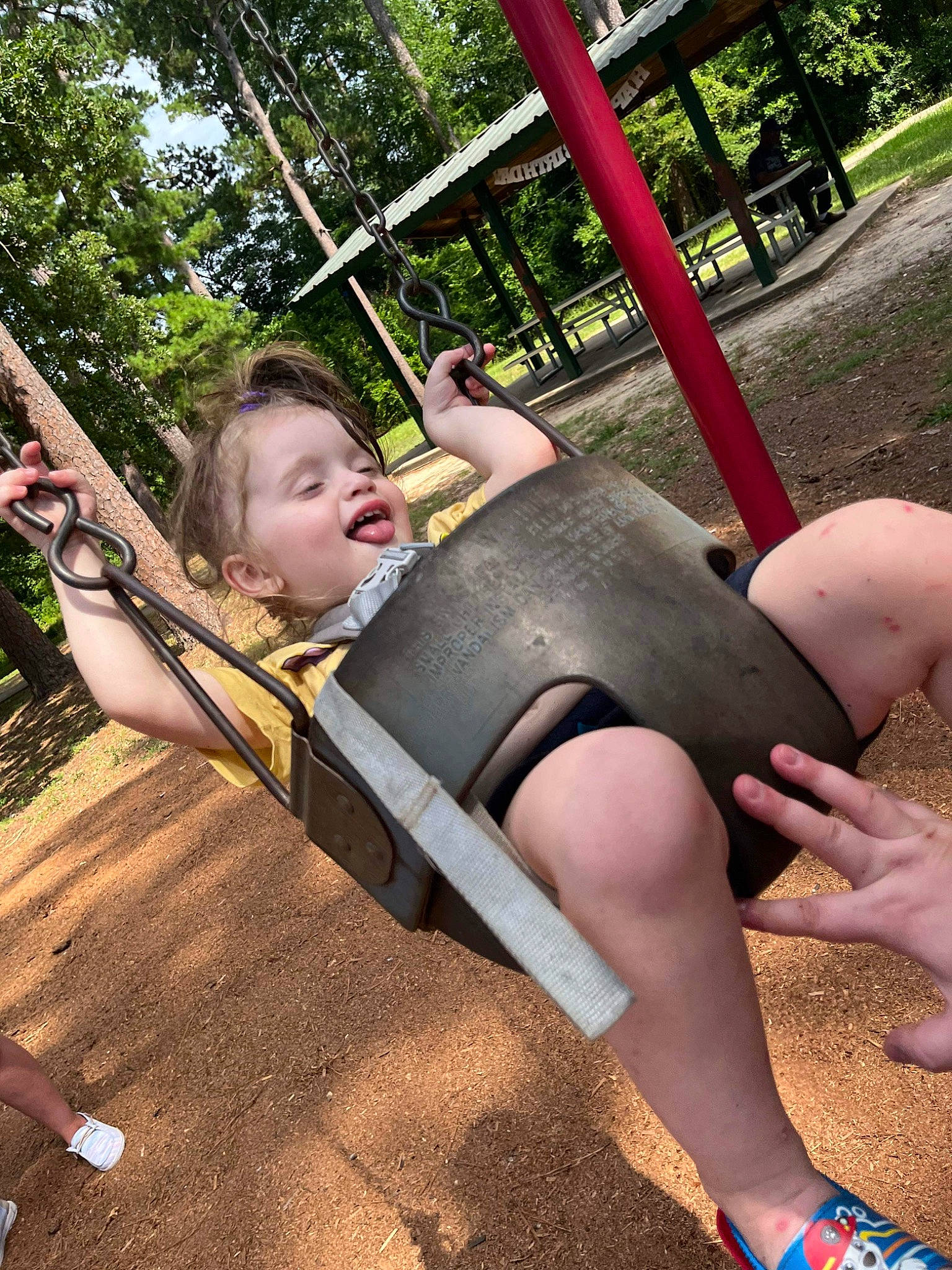 Eli joined the competition — help win amazing prizes! baby_toddler_clothing, calf, city, comfort, fun, grass, happy, human_leg, knee, leisure, outdoor_play_equipment, person, plant, playground, recreation, sitting, smile, swing, thigh, toddler