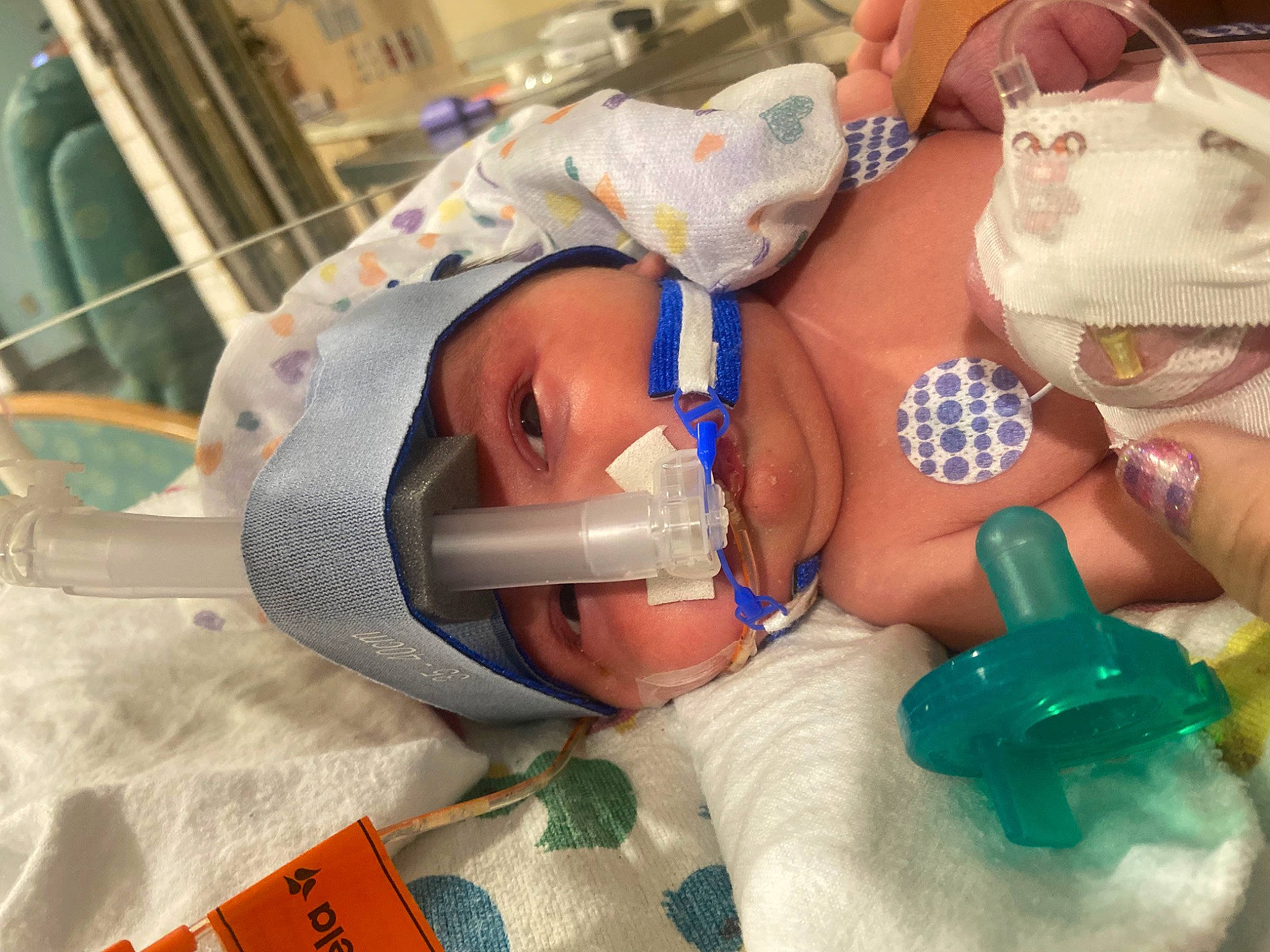 Ryker is registered to the contest to win money with this photo: baby, child, clinic, dental_hygienist, event, headwear, health_care, health_care_provider, hospital, medical, medical_equipment, medical_procedure, mouth, patient, pediatrics, person, plastic, room, service, skin