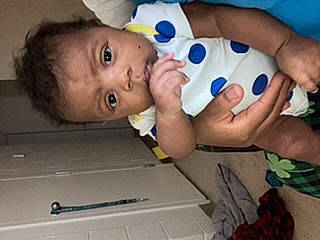 Imani is registered to the contest to win money with this photo: baby, baby_grabbing_for_something, baby_products, baby_toddler_clothing, baby_toys, cheek, child, face, finger, foot, fun, hand, head, mouth, nail, nose, person, skin, thumb, toddler