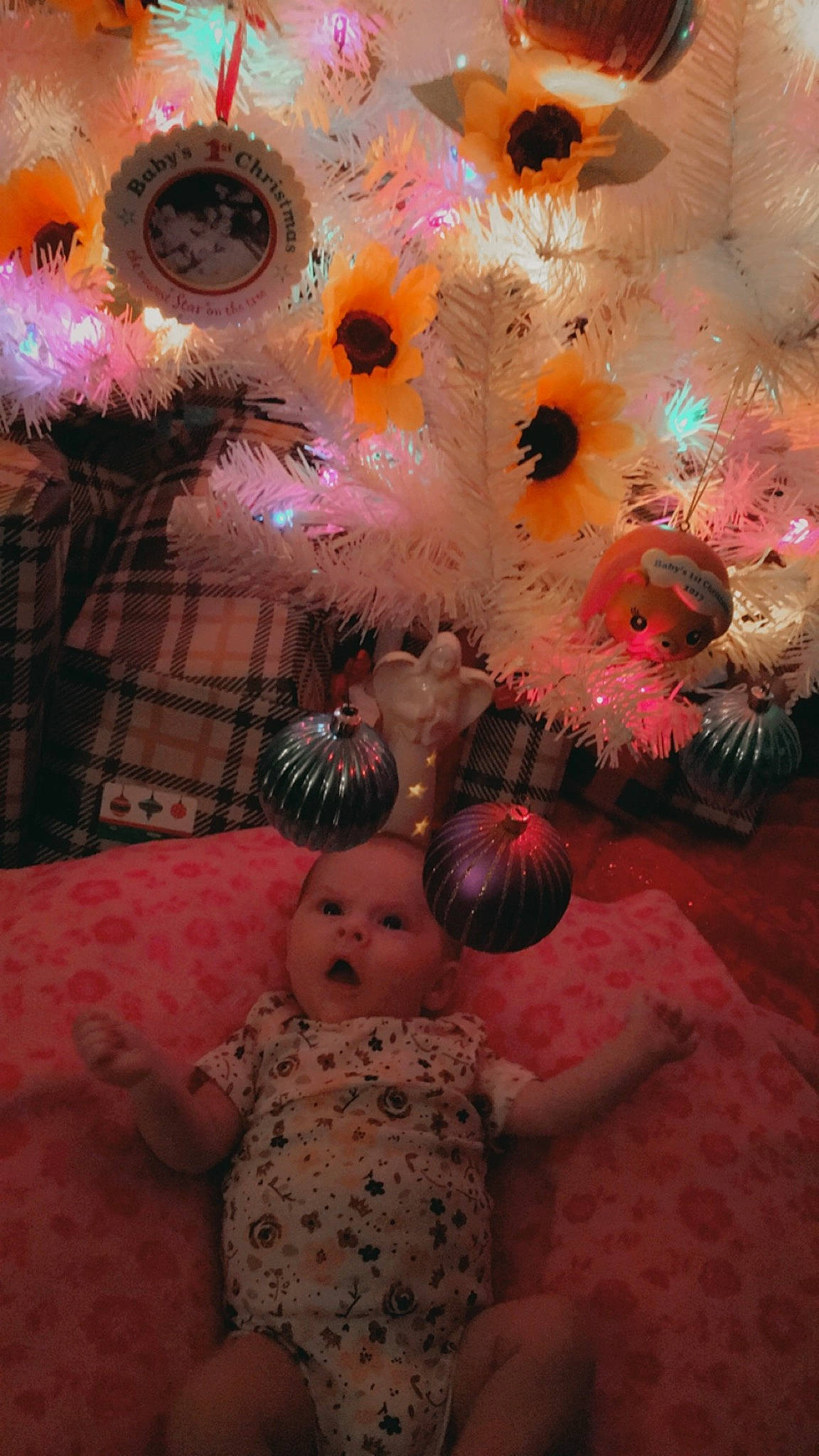 Kaycelynn is registered to the contest to win money with this photo: baby_toddler_clothing, baby_toys, christmas, christmas_decoration, christmas_ornament, christmas_tree, doll, holiday, holiday_ornament, natural_material, ornament, peach, person, pink, surprise, toy