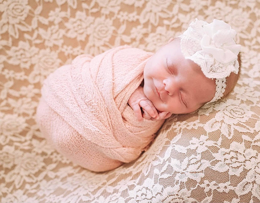 Ellie is registered to the contest to win money with this photo: art, baby, baby_sleeping, baby_toddler_clothing, child, comfort, eye, fashion_accessory, flooring, hair_accessory, hand, headgear, headwear, linens, pattern, person, pink, skin, toddler, towel
