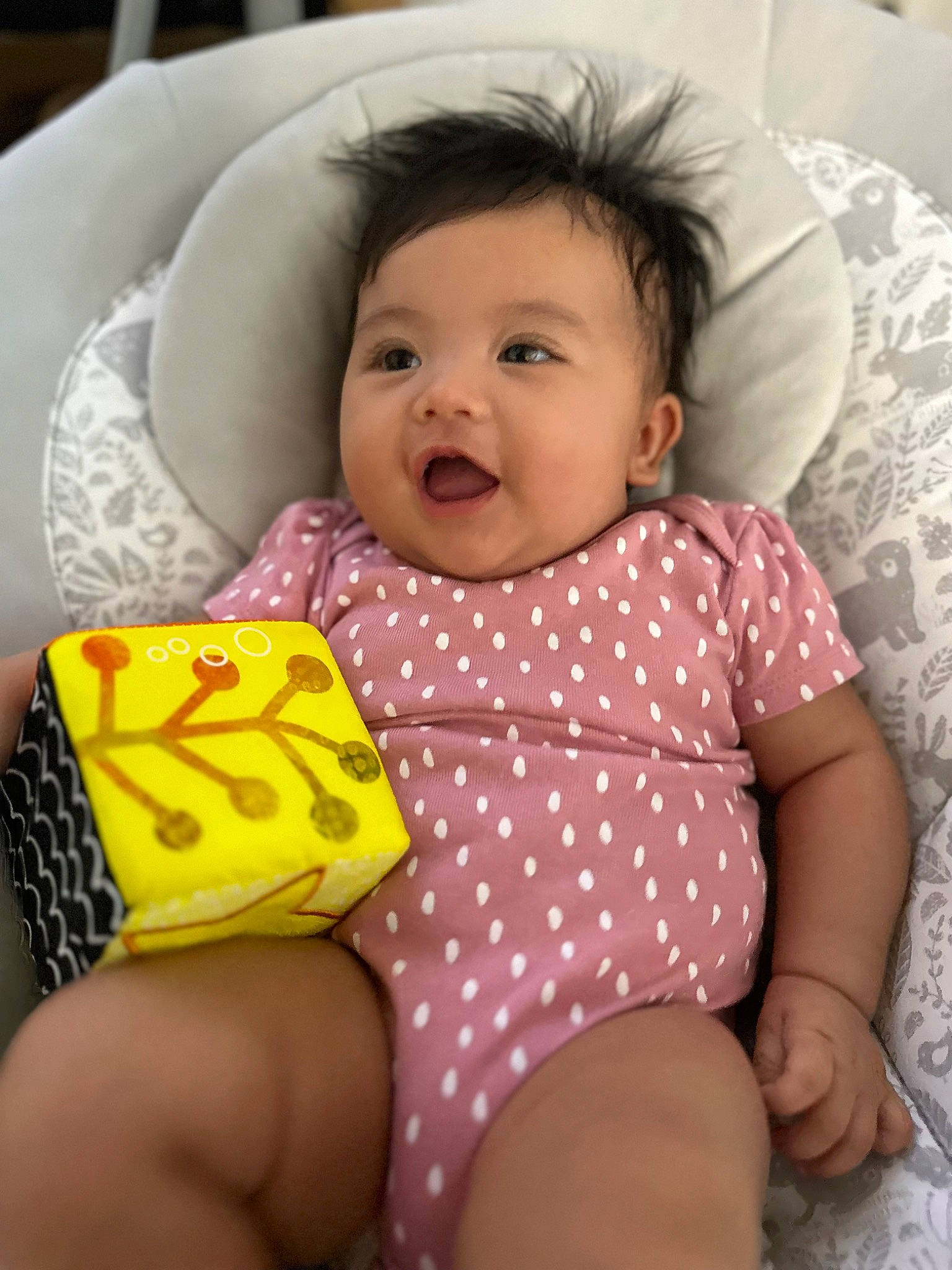 Raiya is registered to the contest to win money with this photo: arm, baby, baby_toddler_clothing, cheek, child, comfort, facial_expression, finger, human, mammal, mouth, organ, people, person, pink, product, skin, sleeve, smile, textile