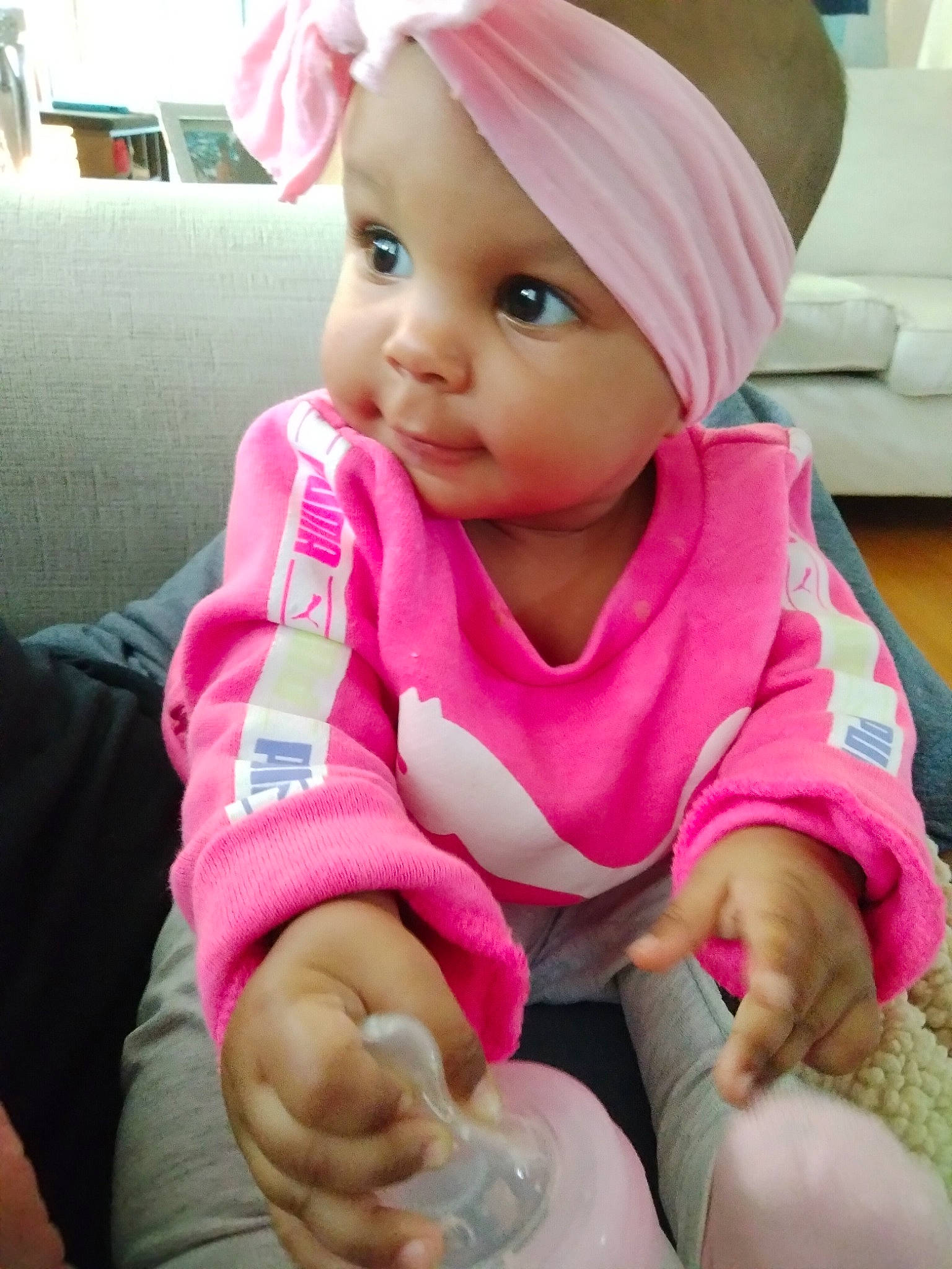 Raeja joined the competition — help win amazing prizes! baby, baby_toddler_clothing, cap, cheek, child, comfort, eye, eyelash, finger, happy, headwear, lip, magenta, nail, nose, person, pink, sitting, skin, sleeve