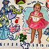 baby, princess_dress, tiara, smiling, blanket, cartoon_princesses, toys, roses, month_marker, pink, blue, yellow, green, happy, child, floor, cute, celebration, portrait, infant