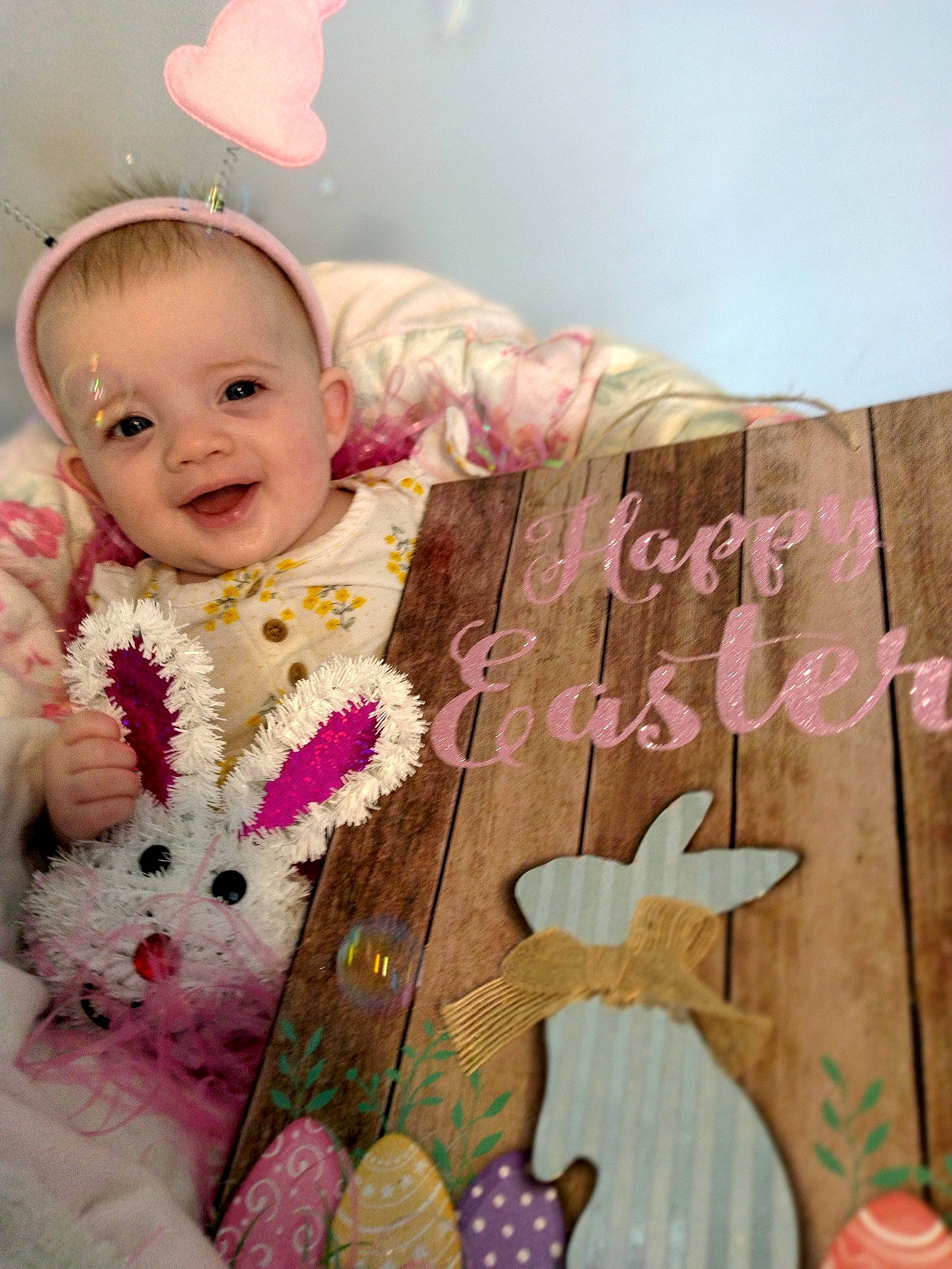 Braelynn is registered to the contest to win money with this photo: baby, baby_products, baby_toddler_clothing, baby_toys, child, happy, joy, linens, magenta, pattern, person, pink, play, product, room, sitting, sleeve, smile, textile, toddler