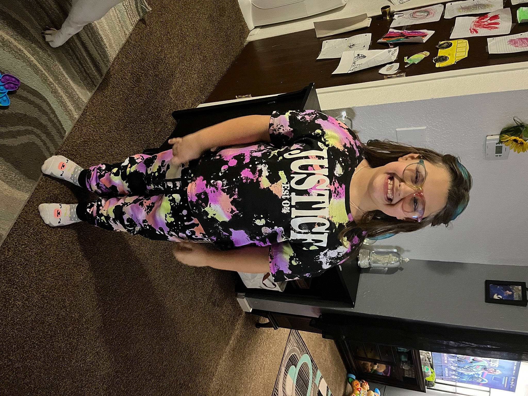 Kayla is registered to the contest to win money with this photo: art, automotive_design, eyewear, fashion_design, flooring, fun, human_leg, joy, knee, machine, magenta, pattern, person, room, shelf, shelving, smile, thigh, visual_arts, waist