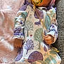 baby, blanket, bonnet, clothing, coat, couch, dress, face, furniture, hat, head, homedecor, jacket, newborn, person, photography, portrait, quilt, sitting, sleeping