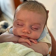 Krew is registered to the contest to win money with this photo: arms, baby, blanket, calm, child, closeup, comfort, cute, face, hand, indoors, infant, newborn, peaceful, portrait, resting, skin, sleeping, soft, warm