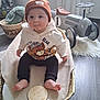 baby, beanie, hoodie, bear_print, basket, blanket, toy_car, plush_bunny, flooring, indoors, child, cute, smiling, sitting, footwearless, wooden_floor, decor, soft_toys, number_one, warm_clothing