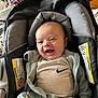 Huxley is registered to the contest to win money with this photo: baby, car_seat, casual_wear, child, closeup, clothing, cute, face, happy, hoodie, indoor, infant, nike_logo, person, portrait, safety, seatbelt, smiling, young_child, zipper